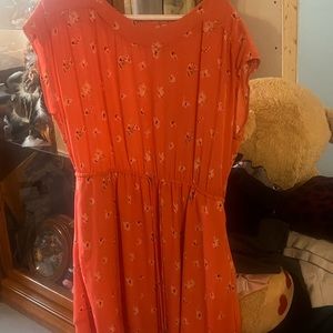 It was only wear a few times. Dress peach Color with flower